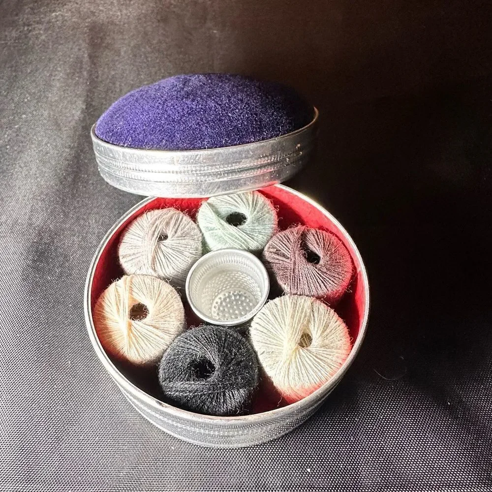 Vintage 1950s round pin cushion sewing tin complete with thread